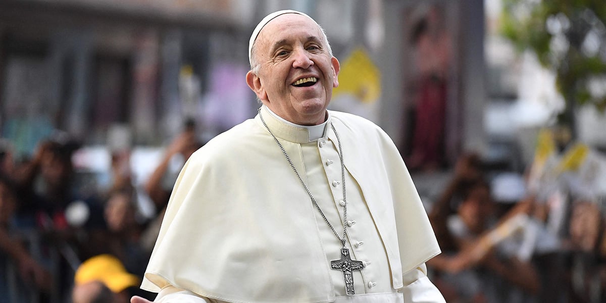 Pope Francis smiles at the faithful from the Popemobile in Santiago, on January 15, 2018. — AFP