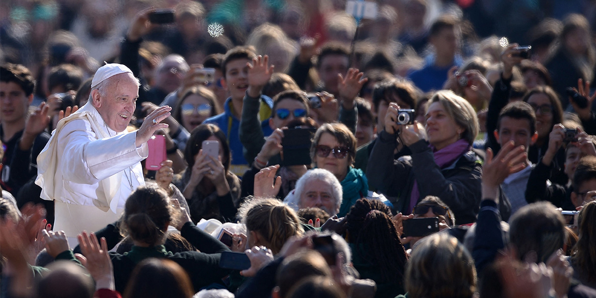 Pope Francis waves to the crowd as he arrives for a weekly general audience at St Peters square in Vatican on April 5, 2017. — AFP