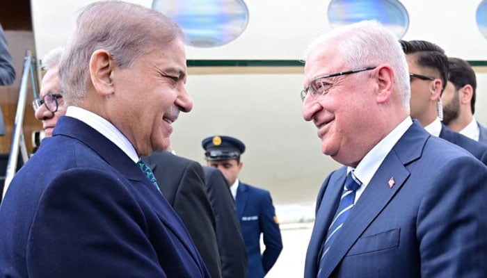 Turkiyes Defence Minister Yashar Guler (right) receives Prime Minister Shehbaz Sharif at the airport on April 22, 2025. — Radio Pakistan