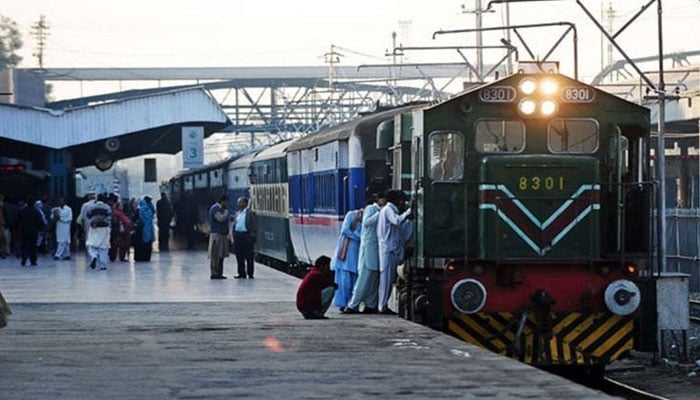 An undated image showing passengers boarding a Pakistan Railways train at a station. — AFP/File