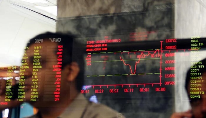 A stock trader views the performance of shares on a trading screen at PSX.— Reuters/File