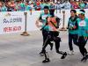 Robots lag behind humans in world's first humanoid half-marathon in China