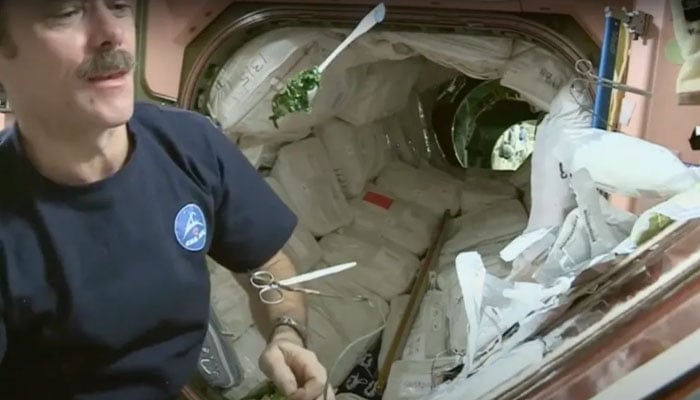 An astronaut eating a meal in space. — NASA/File