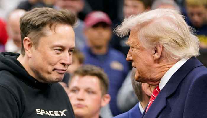 Tesla CEO Elon Musk greets US President Donald Trump as they attend the NCAA mens wrestling championships in Philadelphia, Pennsylvania, US, March 22, 2025. — Reuters