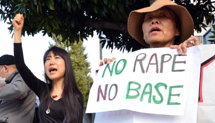 Civic groups in Tokyo protest the alleged rape of a Japanese woman by two US servicemen on October 20, 2012. —AFP