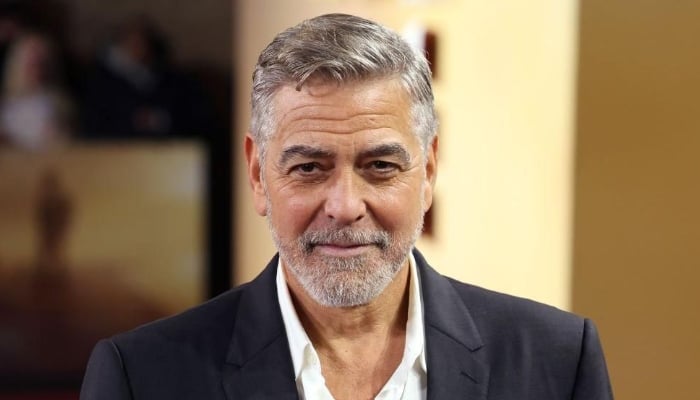 Photo: George Clooney jokes about Brad Pitt while receiving new honour