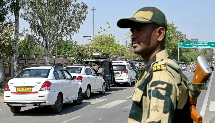 An Indian Border Security Force (BSF) personnel stands guard as Pakistani citizens return to their country through the India-Pakistan Attari-Wagah border post, on April 26, 2025. — AFP