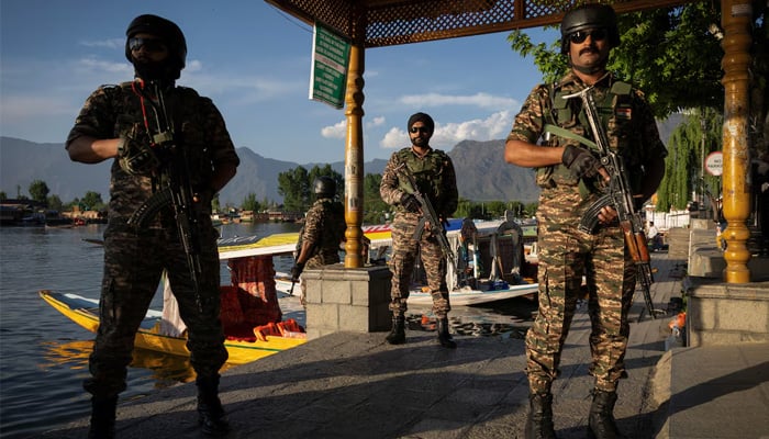 Indian security force personnel stand guard on the banks of Dal Lake, following a suspected militant attack near south IIOJKs Pahalgam, in Srinagar April 25, 2025. — Reuters