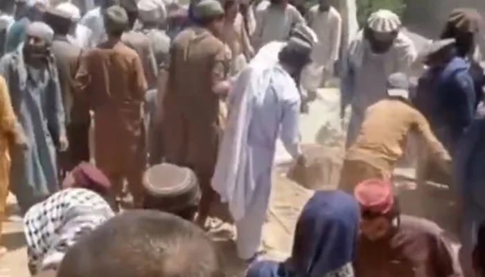 People gather at the site of the blast near the peace committee office in Wana, South Waziristan, Khyber Pakhtunkwa, April 28, 2025. — Screengrab via YouTube/Geo News