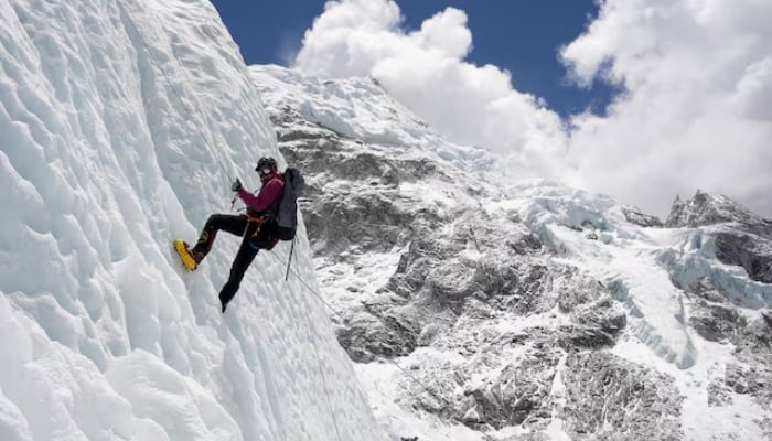A mountaineer holds on to the rope during an ice climbing session at Everest base camp, Nepal, on April 15, 2025. —Reuters