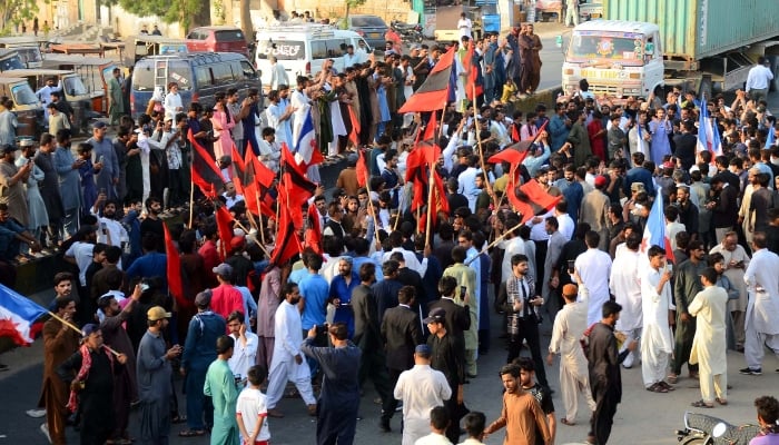 Activists of nationalist party and lawyers block a road as they are holding a protest demonstration against building new canals, at Bypass road in Hyderabad on Sunday, April 27, 2025. — PPI