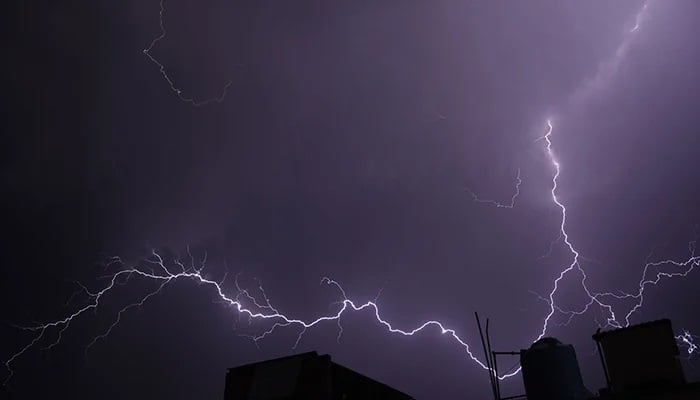 A stunning view of lightning during a thunderstorm before heavy rain late at night in Rawalpindi on June 15, 2023. — Online