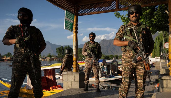 Indian security force personnel stand guard on the banks of Dal Lake after the attack on tourists near Pahalgam in Srinagar, IIOJK, on April 25, 2025. — Reuters