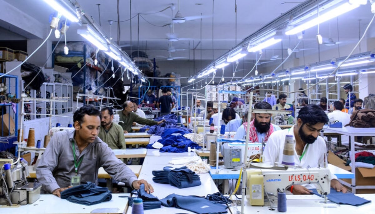 Tailors work at a garment factory in Pakistan. — AFP/File