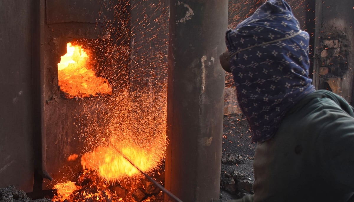 A labourer works at an iron factory in Lahore. — Online/File
