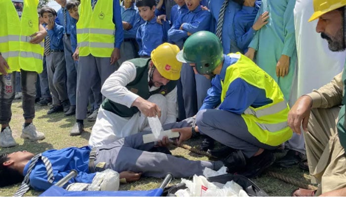 Workers from Pakistans Civil Defence Department give first aid training for schoolchildren as tensions rise with India over a deadly attack in Indian Illegally Occupied Jammu and Kashmir (IIOJK). — AFP