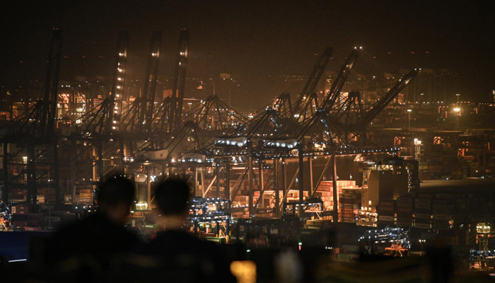Container ships docked at a port. — AFP