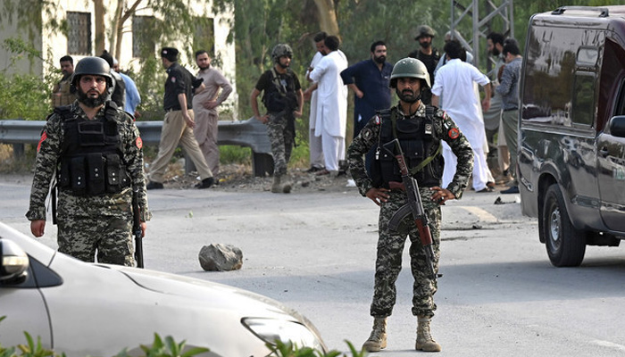 On tenterhooks 1 Pkistani security personnel gather at the site after the bomb blast in Hayatabad area of Peshawar on July 18, 2023. — AFP