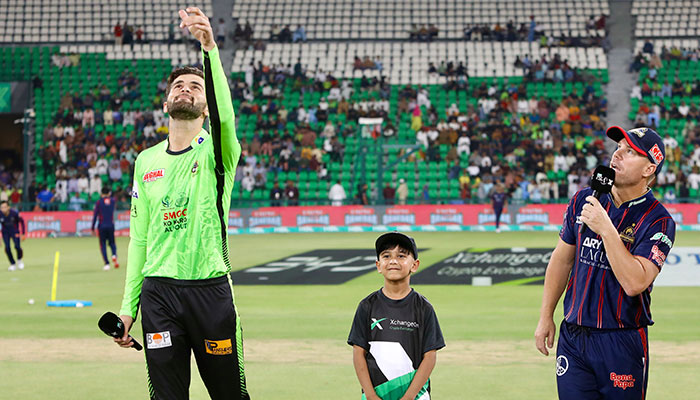 Lahore Qalandars Shaheen Shah Afridi (left) flips the coin as Karachi Kings David Warner looks on at the toss for their PSL 10 match at the Gaddafi Stadium in Lahore on May 4, 2025. — PCB