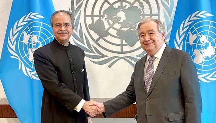 Pakistans Permanent Representative to the United Nations, Ambassador Asim Iftikhar Ahmad (left) shakes hand with UN Secretary-General Antonio Guterres. — APP