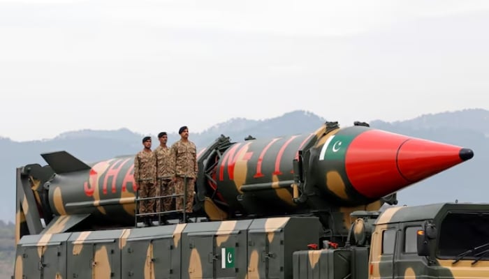 Pakistani military personnel stand beside a Shaheen III surface-to-surface ballistic missile during Pakistan Day military parade in Islamabad, on March 23, 2019. — Reuters