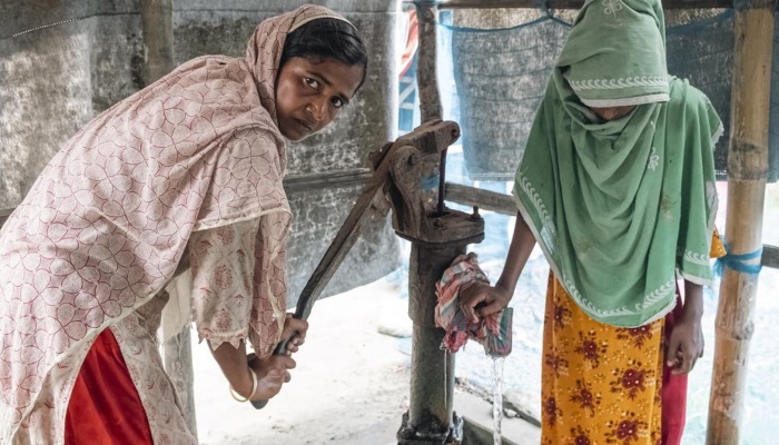 UN warns of 'unsettling' development slowdown in 2024 1 Two women from a destitute area drawing water from a hand pump. — United Nations website