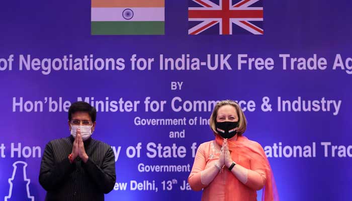 Indias Minister of Commerce and Industry, Piyush Goyal, and British Secretary of State for International Trade Anne-Marie Trevelyan pose for a picture during the launch of free trade agreement (FTA) negotiations between the United Kingdom and India during an event at a hotel in New Delhi, India, January 13, 2022. — Reuters