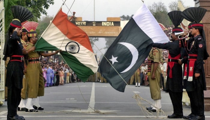 A photograph of Pakistani and Indian soldiers standing on the border of Wagah. - AFP / File