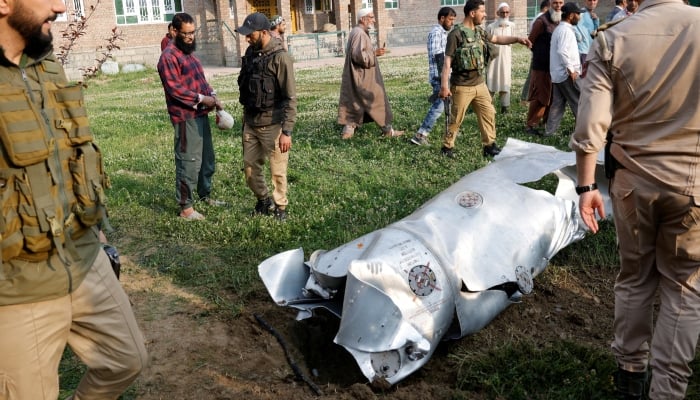 Metal debris lies on the ground in Wuyan in IIOJKs Pulwama district May 7, 2025. — Reuters