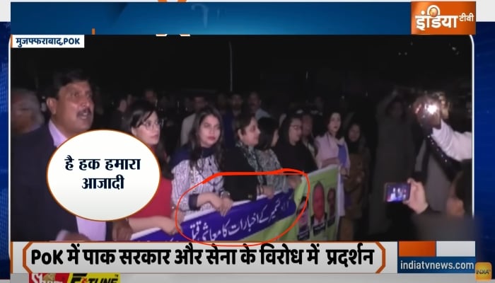 This screenshot from India TV showing press freedom banner held by protesters.