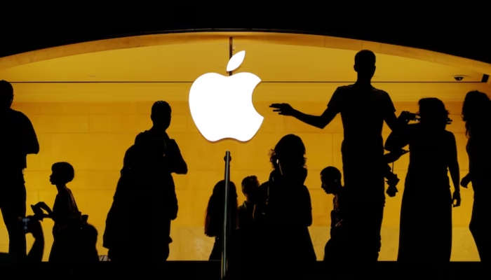 Customers walk past an Apple logo inside of an Apple store at Grand Central Station in New York, US, August 1, 2018. — Reuters