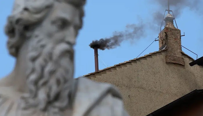 Black smoke rises from the chimney on the Sistine Chapel, indicating no decision has been made to elect a new pope, at the Vatican, May 8, 2025 — Reuters