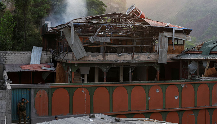 Indian celebrities, YouTubers push back against state propaganda 1 A Pakistan Army soldier stands guard at the entrance as smoke rises from the Bilal Mosque, after it was hit by an Indian strike in Muzaffarabad, the capital of Pakistan-administered Kashmir, May 7, 2025 — Reuters