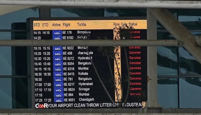 A screen showing cancelled flights is pictured at the Indira Gandhi International Airport after a part of terminal roof collapsed following heavy rains in New Delhi on June 28, 2024. AFP