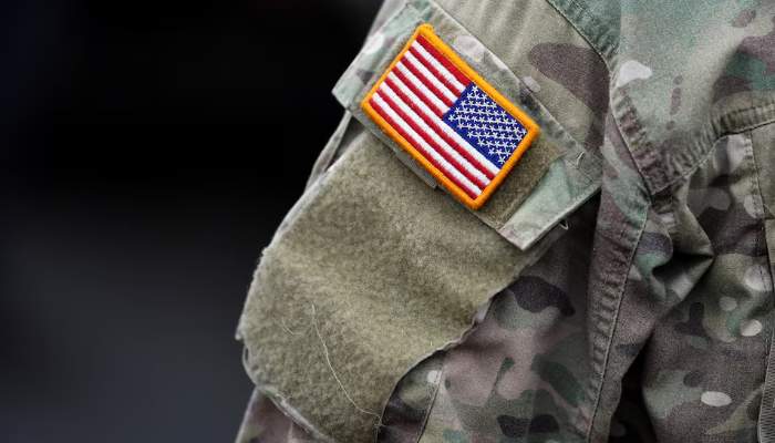 An US flag is pictured on the arm of a soldier of the US 2nd Cavalry Regiment as gear is prepared for deployment to Romania at Rose Barracks in Vilseck, Germany, February 9, 2022. — Reuters