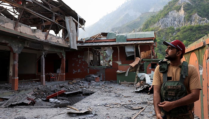 Pakistani soldier stands at the premises of the Bilal Mosque, after it was hit by an Indian strike in Muzaffarabad last week. — Reuters