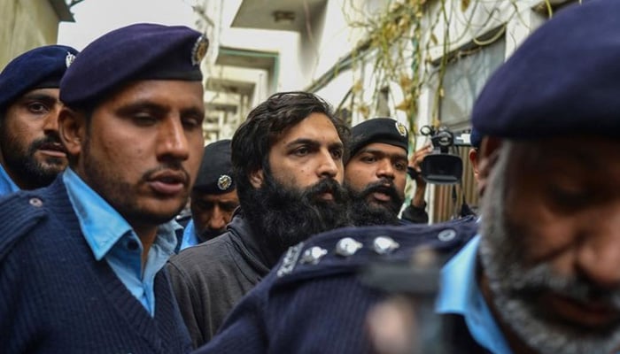 Pakistani-American Zahir Jaffer, convicted to murder Noor Mukadam, arrives in a court in Islamabad on February 24, 2022. — AFP