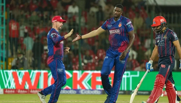 Islamabad Uniteds Jason Holder (centre) celebrates with Colin Munro after dismissing Karachi Kings Aamir Jamal (right) during their PSL 10 match at the National Bank Stadium in Karachi on April 20, 2025. — PCB