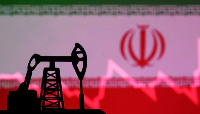 Iranian flag with stock graph and an oil pump jack miniature model are seen in this illustration taken October 9, 2023. — Reuters