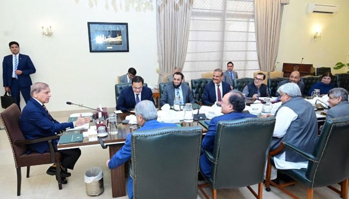 Prime Minister Shehbaz Sharif (left) chairs a review meeting on broadening the tax base and increasing tax revenue in Islamabad on May 13, 2025. — APP