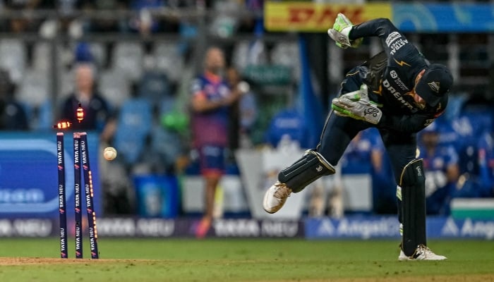 Gujarat Titans wicketkeeper Jos Buttler run outs Mumbai Indians Corbin Bosch during the Indian Premier League (IPL) Twenty20 cricket match between Mumbai Indians and Gujarat Titans at the Wankhede Stadium in Mumbai on May 6, 2025. — AFP