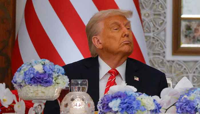 US President Donald Trump listens as Qatars Emir Tamim bin Hamad Al Thani (not pictured) speaks at a state dinner, at Lusail Palace in Lusail, Qatar, May 14, 2025. — Reuters