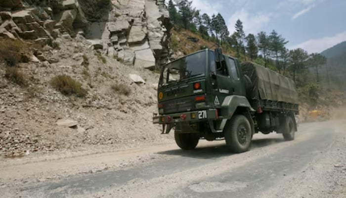 An Indian army truck drives along Indias Tezpur-Tawang highway in Arunachal Pradesh, India May 28, 2012. — Reuters