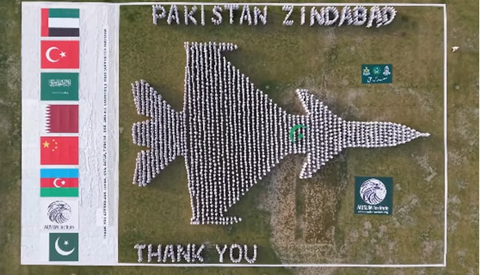Human formation of J-10C fighter jet exhibited by Jhang citizens at Shrine of Hadrat Sultan Bahoo in Shorkot. — Screengrab via Geo News