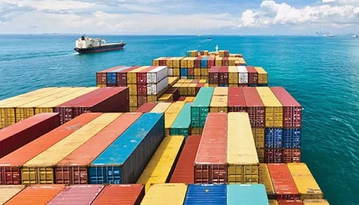 This undated photo shows a cargo ship carrying containers as it sails through international waters. — Reuters
