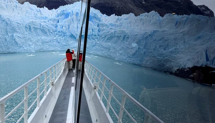 The Perito Moreno glacier is seen reflected in the window of a tourist boat, near the city of El Calafate in the Patagonian province of Santa Cruz, Argentina April 22, 2025 — Reuters