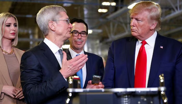 Apple CEO Tim Cook speaks with U.S. President Donald Trump as he tours Apples Mac Pro manufacturing plant with White House senior advisor Ivanka Trump and Treasury Secretary Steven Mnuchin in Austin, Texas, U.S., November 20, 2019 — Reuters