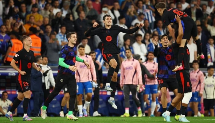 FC Barcelonas Inaki Pena, Dany Olmo, Andreas Christensen, Gerard Martin and Gavi are celebrated after his victory Laliga, RCDE Stadium, Corneella De Llobregat, Spain, May 15, 2025. - Reuters.