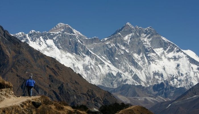 A tourist looks at a view of Mt. Everest from the hills of Syangboche in Nepal. — Reuters/File