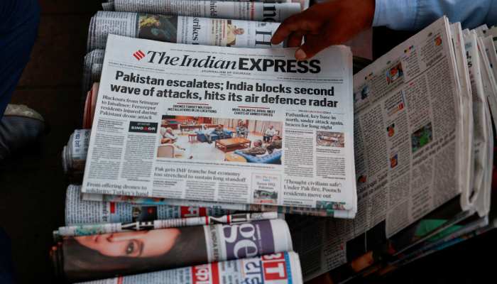 A vendor sorts newspapers with reports of the ongoing India-Pakistan hostilities, in New Delhi, India, May 10, 2025. — Reuters